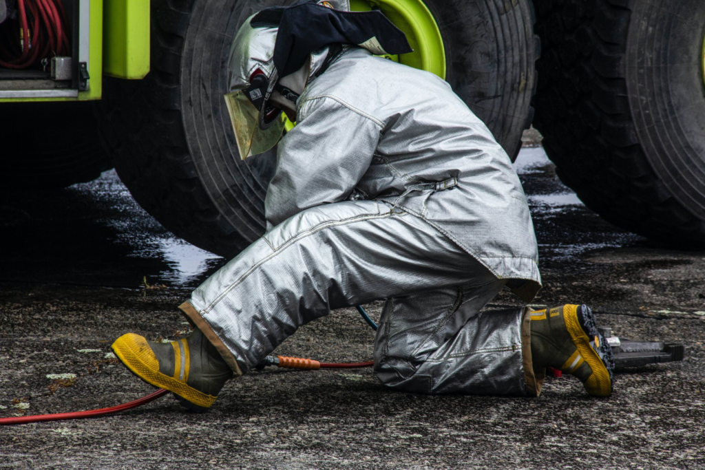a firefighter working with hose