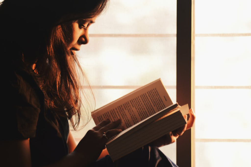 A person reading a fiction book